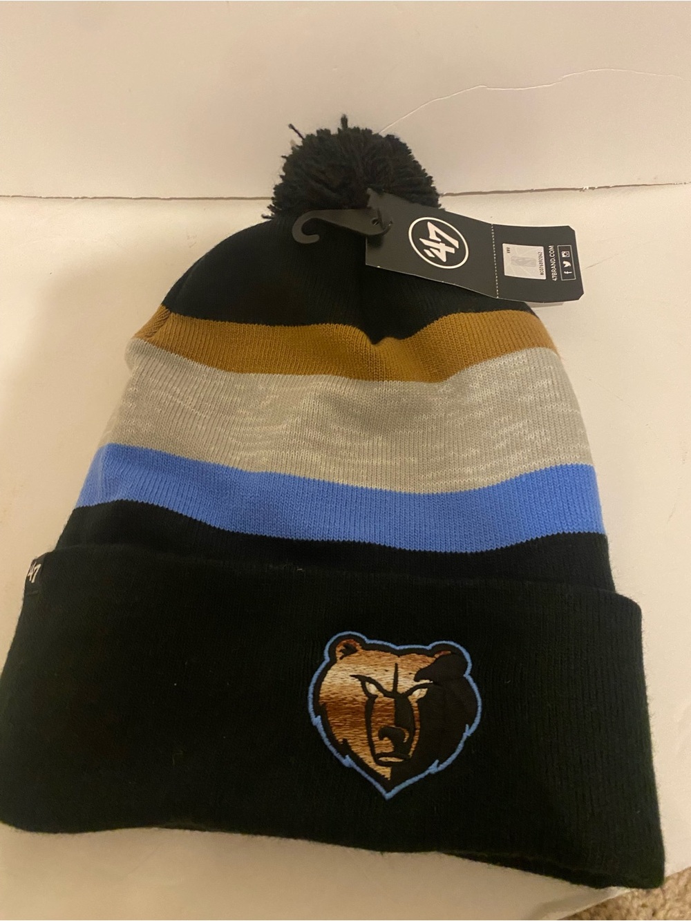 47 Memphis Grizzlies Black Pom Beanie with Blue, Tan & Gray Stripes hat
